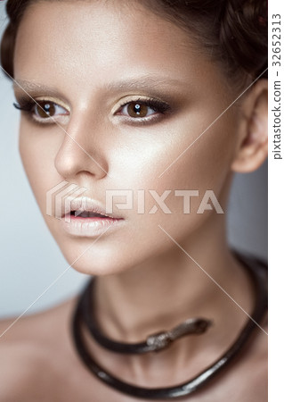 Beautiful girl with art makeup and fashionable 32652313