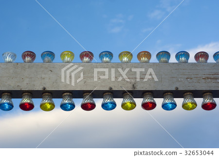 metal banner with electric lights on cloudy sky metal banner with electric lights on cloudy sky 32653044