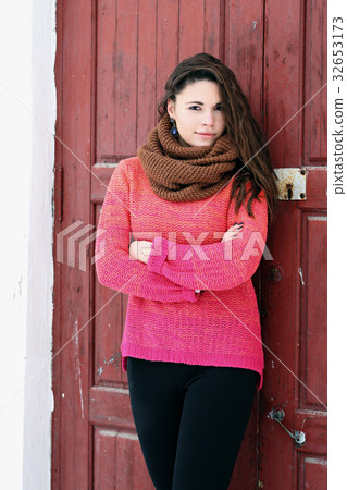 smiling girl in a sweater 32653173