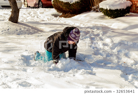 Happy little kid is playing in snow, good winter  32653641