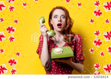 girl in red dress with green dial phone 32656814