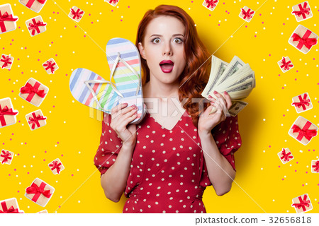 girl in red dress with flip flops and money 32656818