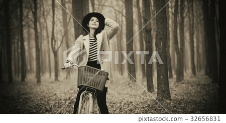 portrait of a young woman with a bicycle portrait of a young woman with a bicycle 32656831