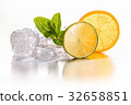Ice cubes, lime and orange. 32658851