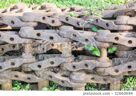 Close up old backhoe chain wheel with rusty 32660694