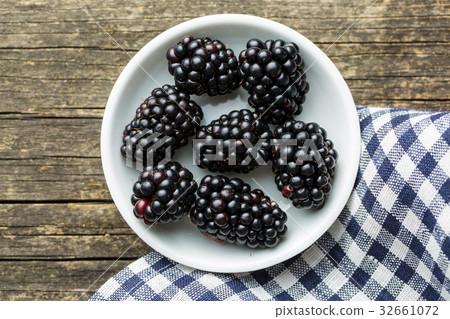 Tasty ripe blackberries in bowl. Tasty ripe blackberries in bowl. 32661072