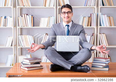 Businessman student in lotus position meditating 32662166