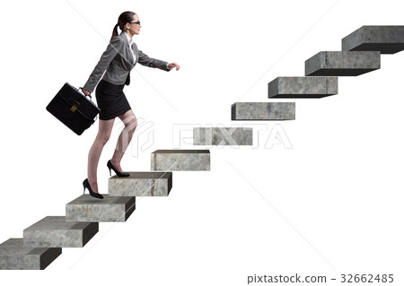 Businesswoman climbing career ladder in business Businesswoman climbing career ladder in business 32662485