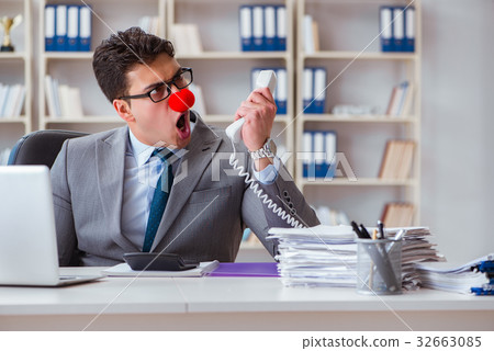 Clown businessman angry frustrated working in the Clown businessman angry frustrated working in the 32663085