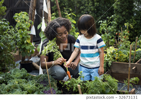 Kids having fun gardening outdoor 32673131