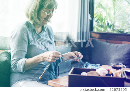 Senior adult woman has knitting activity Senior adult woman has knitting activity 32673305