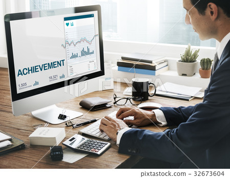 Man working on computer network graphic overlay 32673604