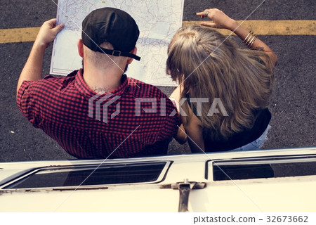 People Checking The Map for Direction on Road Trip People Checking The Map for Direction on Road Trip 32673662