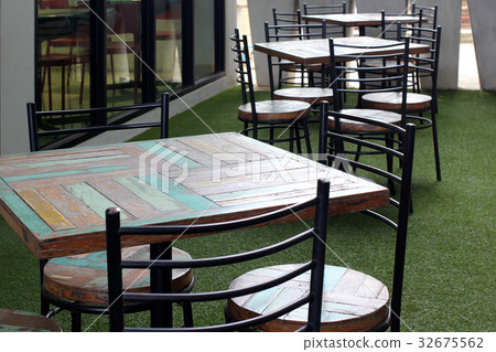 empty wooden and chair set on patio 32675562