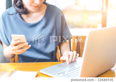 Business woman working in computer and phone 32680556