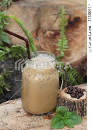 Iced coffee is delicious on wood background. Iced coffee is delicious on wood background. 32680604
