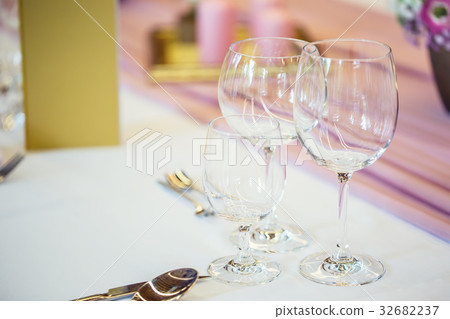 Beautiful table set with flowers and glass cups. Beautiful table set with flowers and glass cups. 32682237