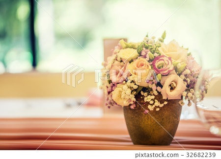 Beautiful table set with flowers and glass cups. Beautiful table set with flowers and glass cups. 32682239