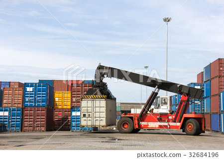 Crane lifting up container in cargo at the port Crane lifting up container in cargo at the port 32684196