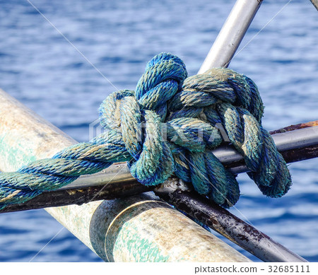 Old blue robe on wooden boat Old blue robe on wooden boat 32685111