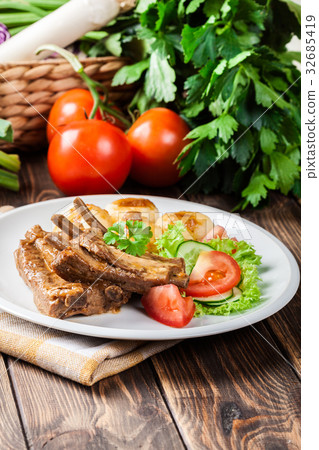 Pork spareribs served with silesian noodles 32685419
