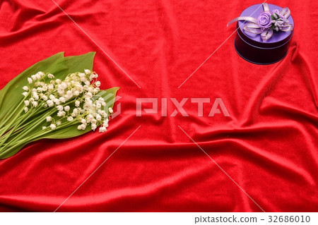 Flower of the Valley on a red background Flower of the Valley on a red background 32686010
