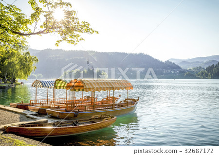 Boats at the shore of Bled Lake in Slovenia Boats at the shore of Bled Lake in Slovenia 32687172