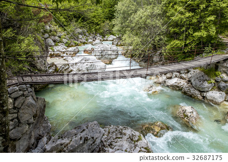 Old wooden bridge over Soca river Old wooden bridge over Soca river 32687175