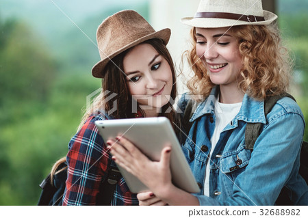 Two girls in hats traveling through ruins Two girls in hats traveling through ruins 32688982