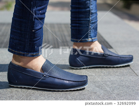 A man in blue moccasins 32692099