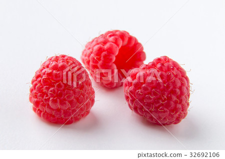 Raspberries on a white background Raspberries on a white background 32692106