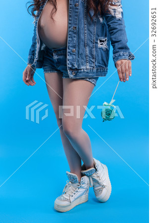 Lollipop in hand of pregnant woman Lollipop in hand of pregnant woman 32692651