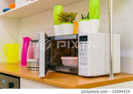 Close up opened modern microwave oven 32694554