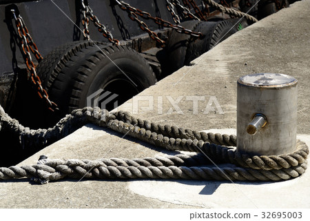 Ship anchor iron anchor bollard bollard truss bollard pile pile rope rope rope rope mooring rope rope tire port pier 32695003