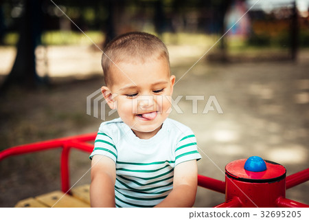 Little boy is a bright playground. Little boy is a bright playground. 32695205