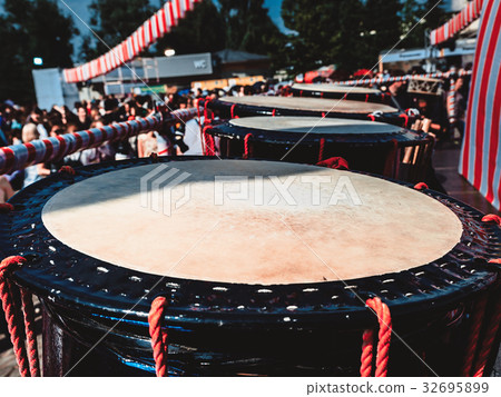 Taiko drums o-kedo on scene people on background. Taiko drums o-kedo on scene people on background. 32695899