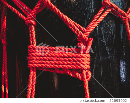 Knots from red ropes taiko drum o-kedo background. 32695902