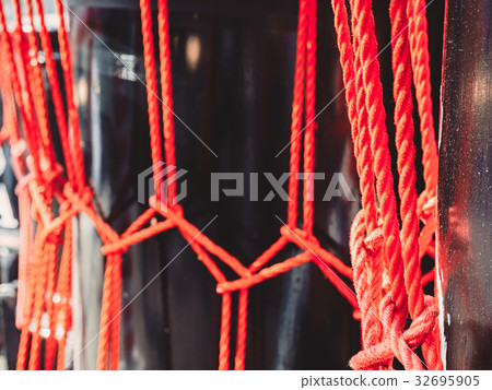 Knots from red ropes taiko drum o-kedo background. 32695905