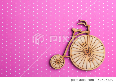 Pink polka dot background with bike 32696789
