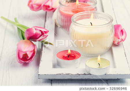 Yellow and pink aroma candles with tulips Yellow and pink aroma candles with tulips 32696946