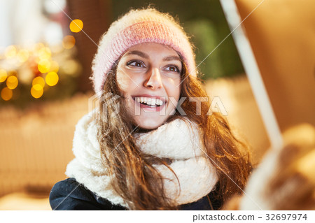 Young woman using tablet computer on the street Young woman using tablet computer on the street 32697974