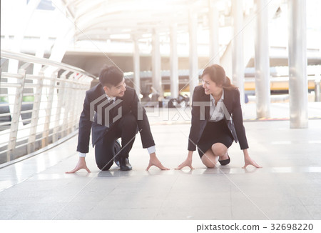 Businessman and businesswoman ready for race in business Businessman and businesswoman ready for race in business 32698220