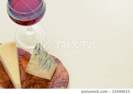 The glass of red wine, blue cheese and parmesan on The glass of red wine, blue cheese and parmesan on 32699633
