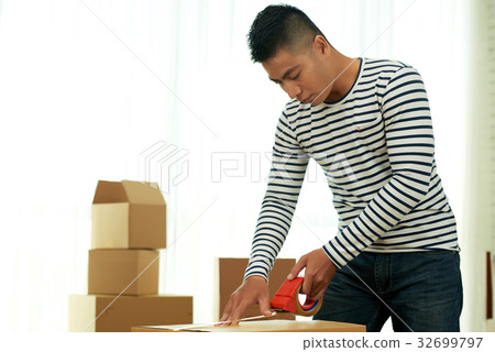 Vietnamese Man Packing Stuff 32699797
