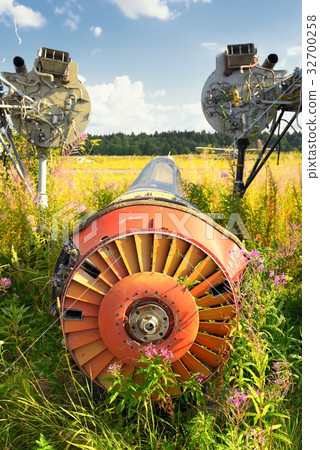 Old airplane fuselage on green grass Old airplane fuselage on green grass 32700258