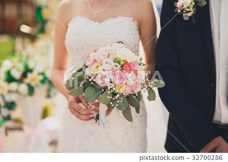 Pretty good wedding bouquet of various flowers in 32700286