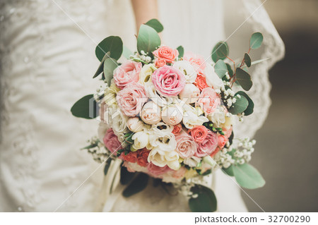 Pretty good wedding bouquet of various flowers in 32700290
