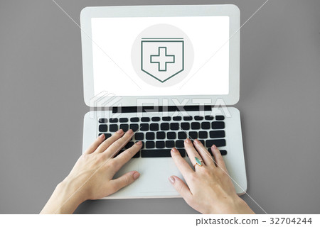 Hands working on laptop network graphic overlay 32704244