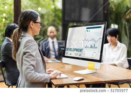 Woman working on computer network graphic overlay 32705977