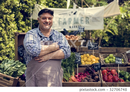 Greengrocer selling organic fresh agricultural product at farmer 32706748
